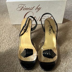 Onex - Black Patent with gold bow heels